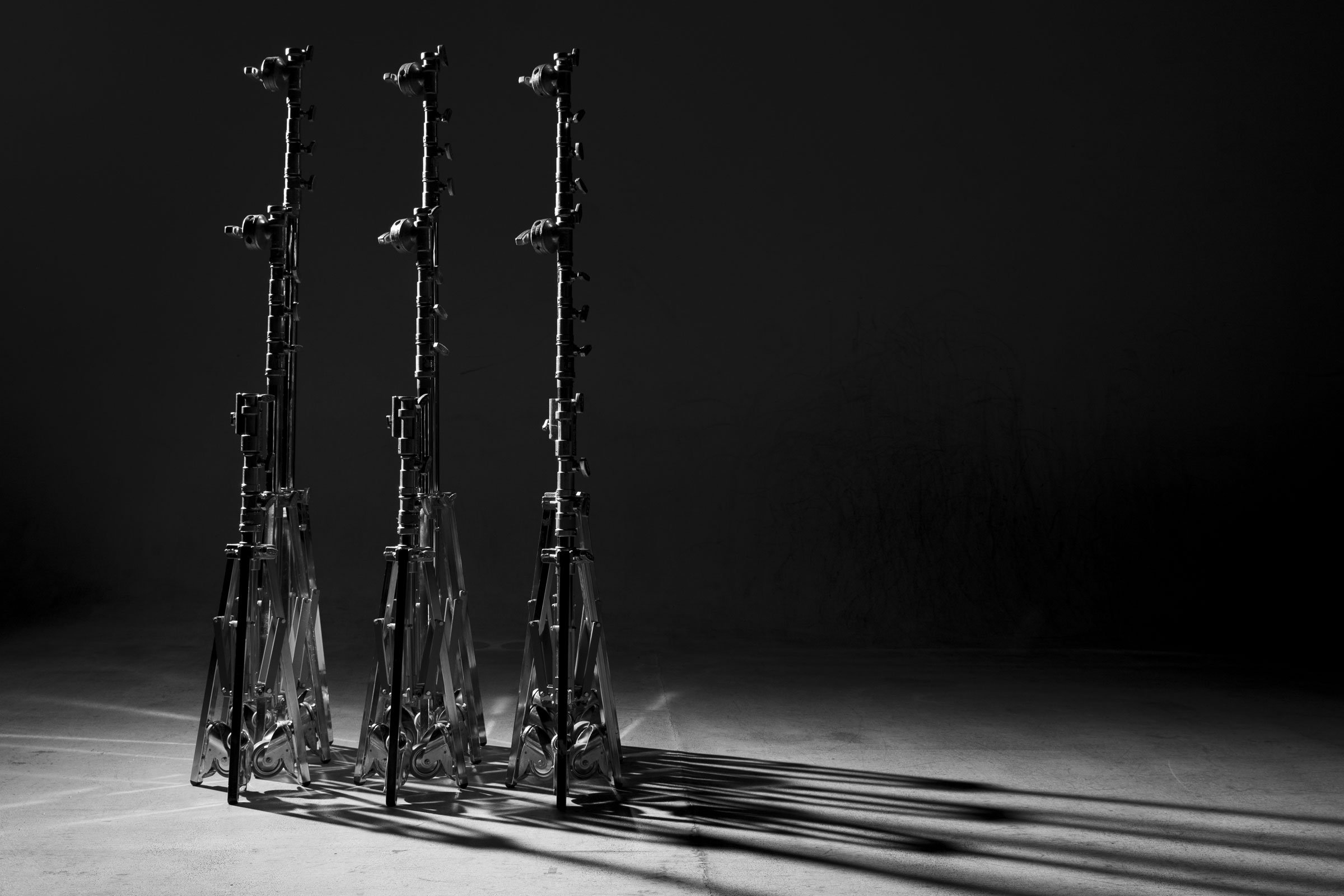 OTMFC grip stands photographed against a dark background