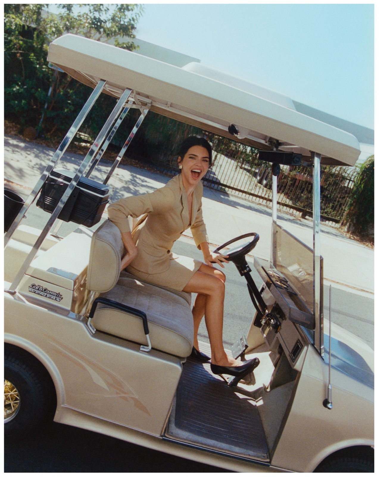 Kendall Jenner seated in a golf cart for the A Rabbit’s Foot editorial, photographed by @rasmuswengkarlsen