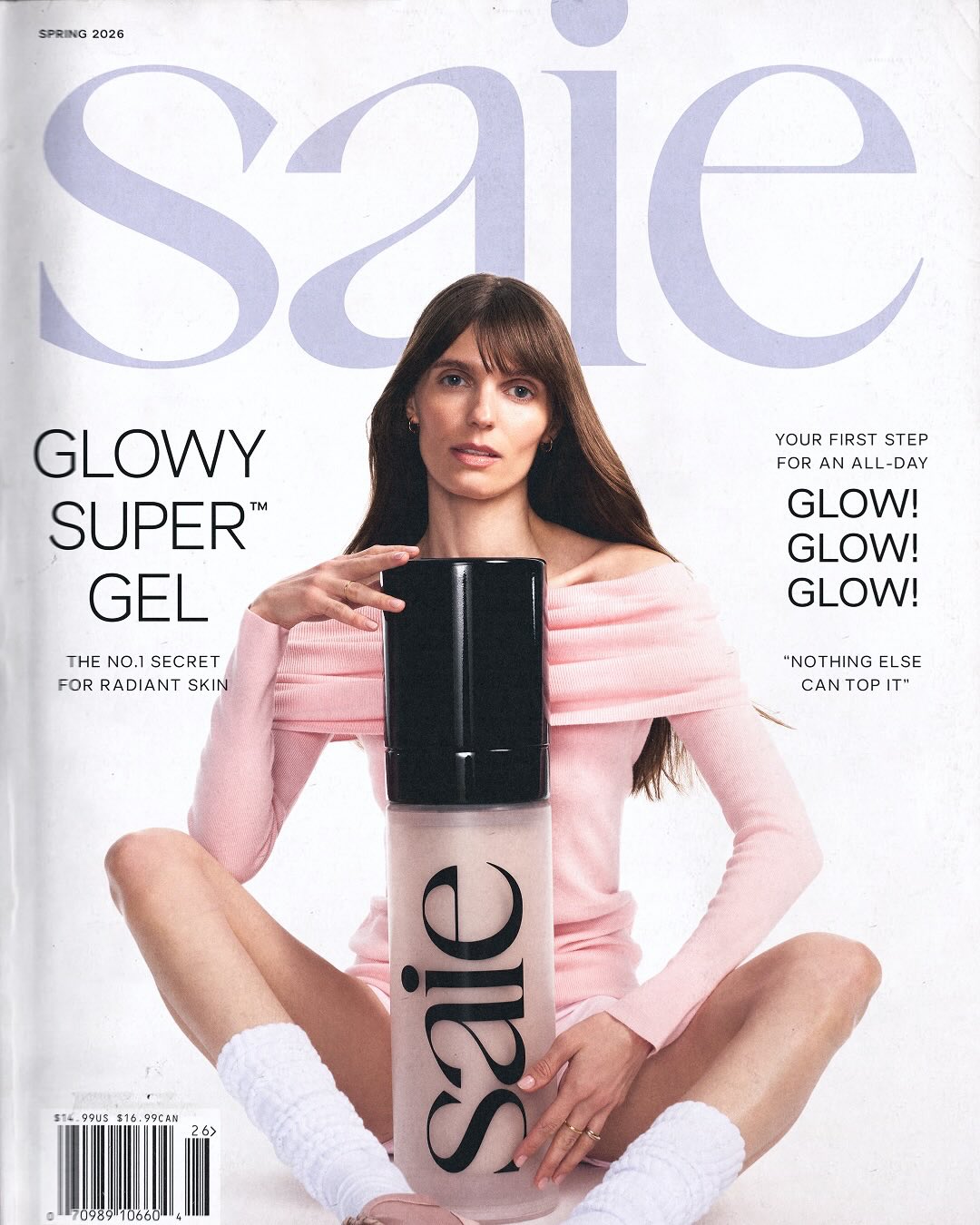 Saie Beauty Spring 2026 campaign with a model in pink holding an oversized Glowy Super Gel bottle